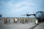 U.S. Military logistics personnel stationed in Japan tour a C-130J Super Hercules during a “Theater Service 4 Summit” hosted by U.S. Forces Japan and fifth Air Force on Yokota Air Base, Aug. 27, 2025. The summit addressed the critical challenges facing military logistics operations while transitioning to a more operational posture and examining supply chain dynamics, and distribution operations across the Pacific theater. (U.S. Air Force photo by Tech. Sgt. Emerson Nuñez)