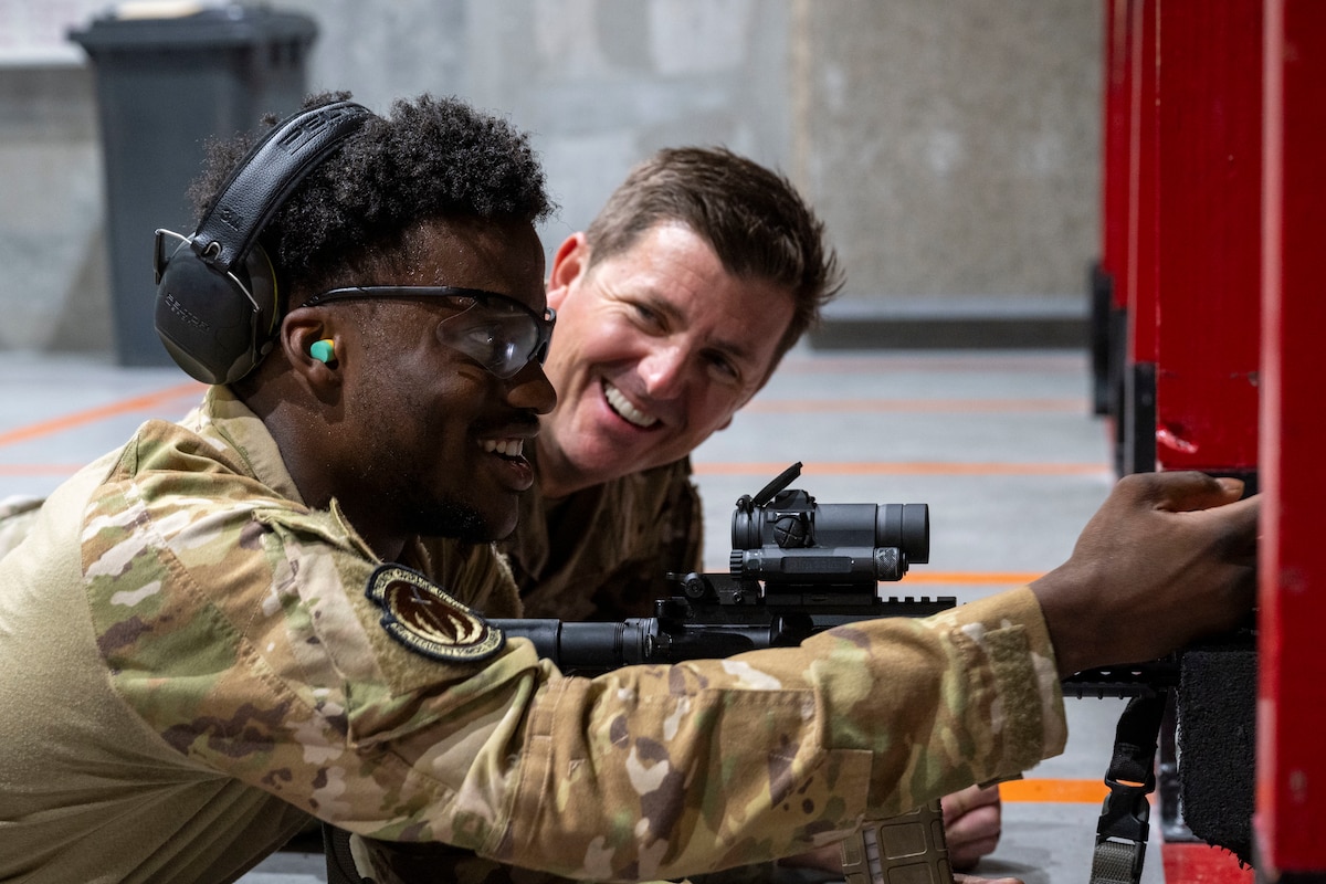 U.S. Air Force Col. Matthew Hoyt, right, 35th Fighter Wing (FW) deputy commander, listens to Airman 1st Class Ricky Williams, 35th Security Forces Squadron defender, explain how he sights his rifle during an immersion tour at Misawa Air Base, Japan, Sept. 2, 2025.
