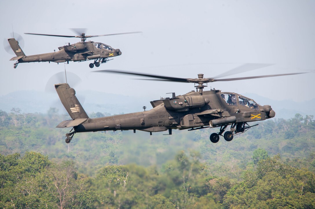 U.S. Army AH-64E Apache Guardian helicopters assigned to the 4th Squadron, 6th Cavalry Regiment, 16th Combat Aviation Brigade, Joint Base Lewis-McChord, Washington, fly into a firing position at the joint land strike exercise with the Indonesian National Armed Forces and Australian Defence Forces during Super Garuda Shield 25 in Baturaja, Indonesia, Sept. 1, 2025.