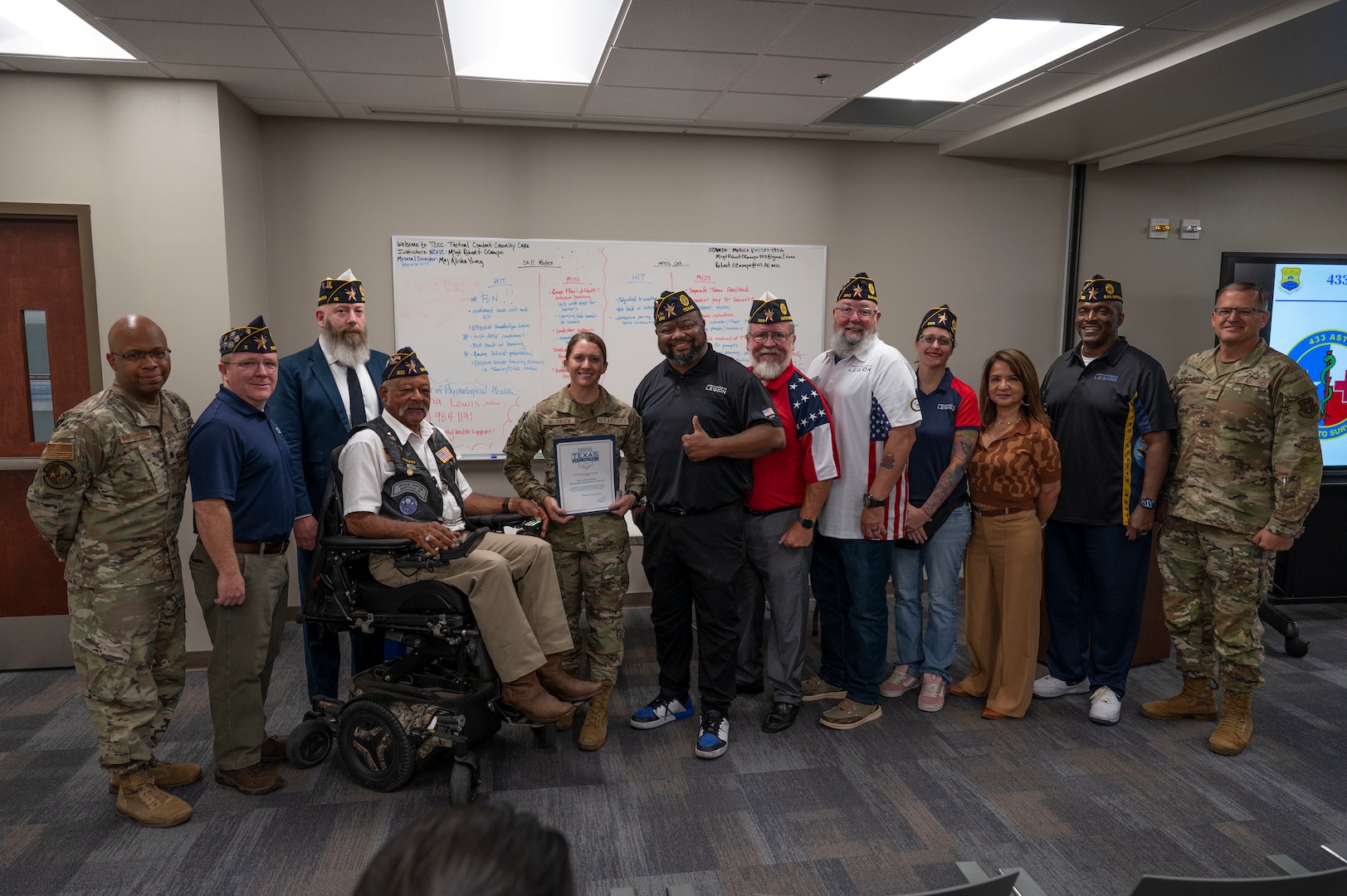 Representatives from various American Legion posts throughout Bexar County came to witness the Spirit of Service Award presentation to Staff Sgt. Lindsey Neubauer, 433rd Aeromedical Staging Squadron, during the 433rd Medical Group’s commander’s call, Aug. 2, 2025.