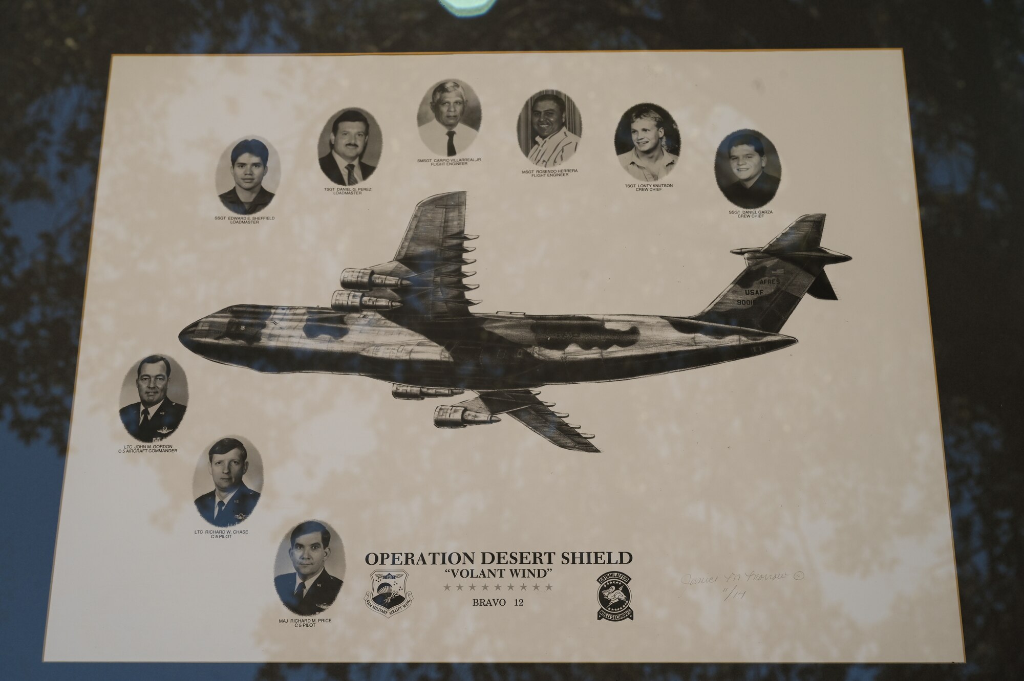A memorial photo collage shows the portraits of the nine 433rd Military Airlift Wing Airmen who lost their lives during the BRAVO-12 crash Aug. 29, 1990.