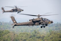 U.S. Army AH-64E Apache Guardian helicopters assigned to the 4th Squadron, 6th Cavalry Regiment, 16th Combat Aviation Brigade, Joint Base Lewis-McChord, Washington, fly into a firing position at the joint land strike exercise with the Indonesian National Armed Forces and Australian Defence Forces during Super Garuda Shield 25 in Baturaja, Indonesia, Sept. 1, 2025.