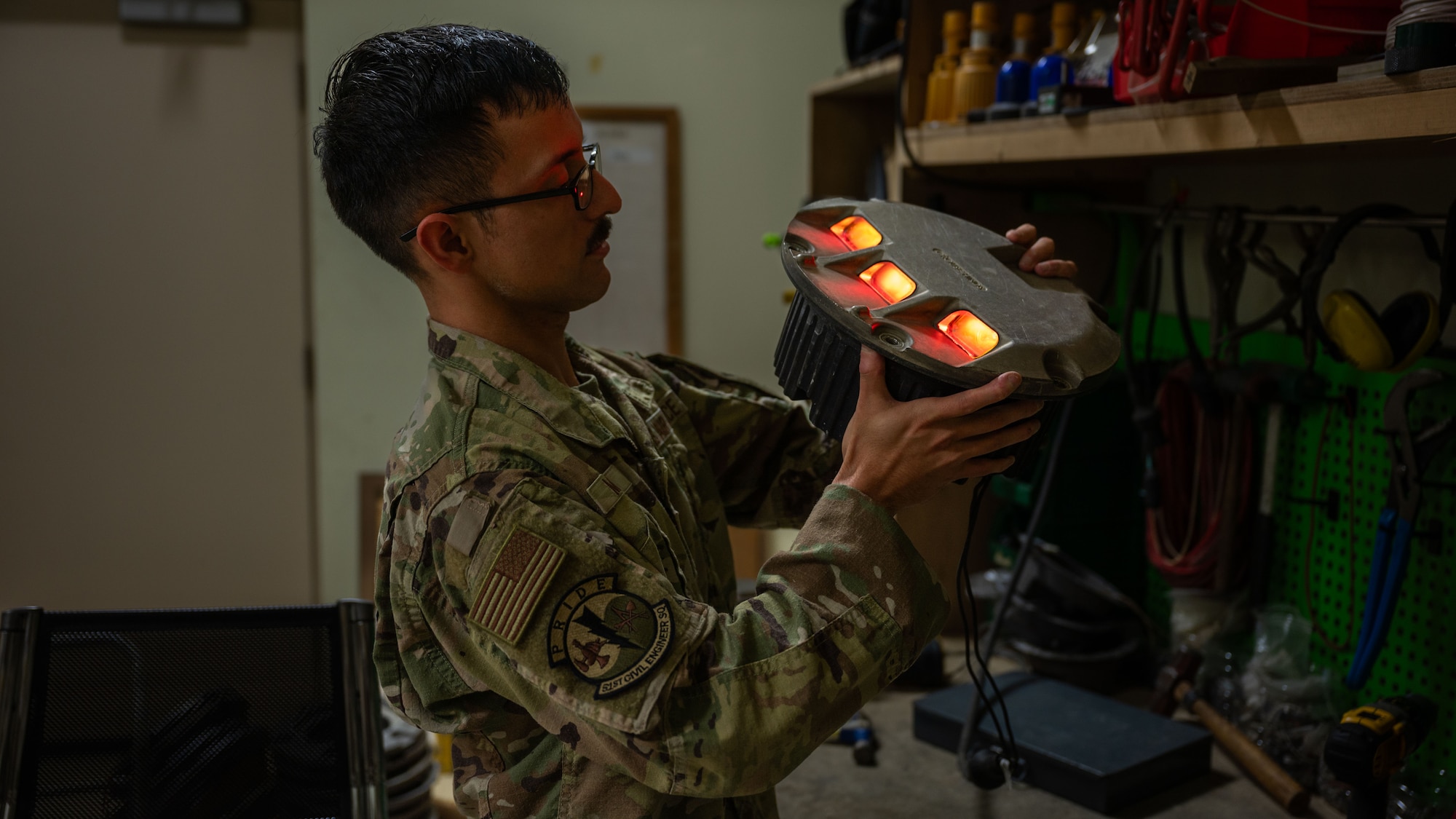 U.S. Air Force Staff Sgt. Jose Medina, 51st Civil Engineer Squadron electrical systems craftsman, inspects an approach light at Osan Air Base, Republic of Korea, Sept. 3, 2025. Medina is tasked with maintaining and certifying the operability of the approach lights, ensuring pilots know whether to land, stop, or align with the runway depending on the color that is displayed. (U.S. Air Force photo by Senior Airman Rome Bowermaster)