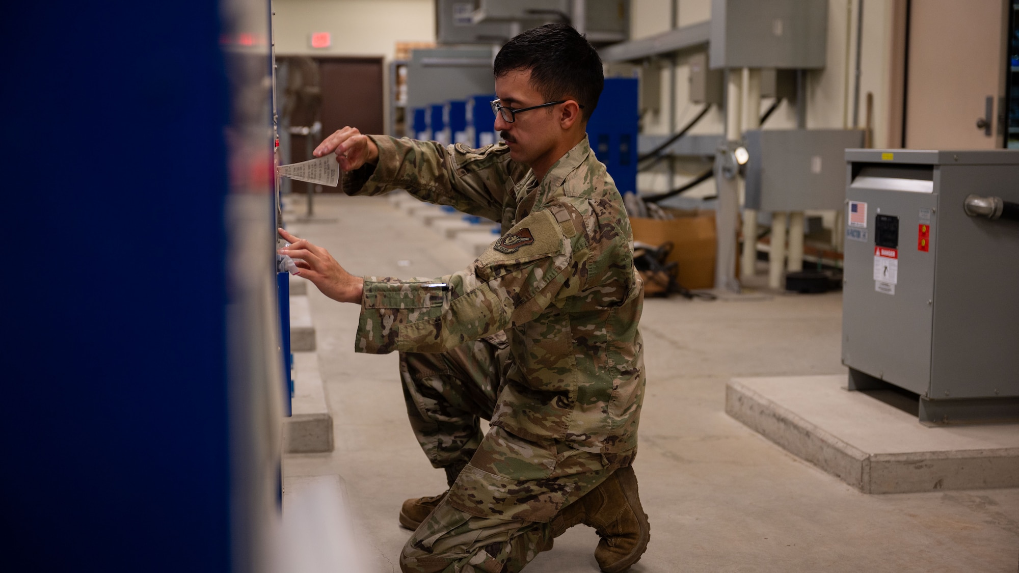 U.S. Air Force Staff Sgt. Jose Medina, 51st Civil Engineer Squadron electrical systems craftsman, troubleshoots different current intensities at Osan Air Base, Republic of Korea, Sept. 3, 2025. The constant current regulator is responsible for sending electricity to all parts of the flightline, keeping signs and lights lit everyday for flightline operations. (U.S. Air Force photo by Senior Airman Rome Bowermaster)