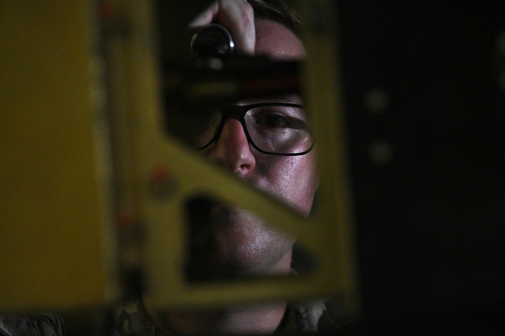 Staff Sgt. Hunter Hood, 431st Expeditionary Reconnaissance Squadron MQ-9 Reaper quality assurance inspector, assists with the installation of an external fuel tank on an MQ-9.