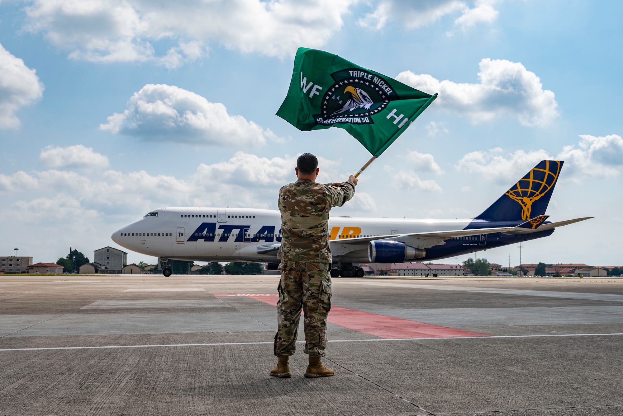 Airman waving flag