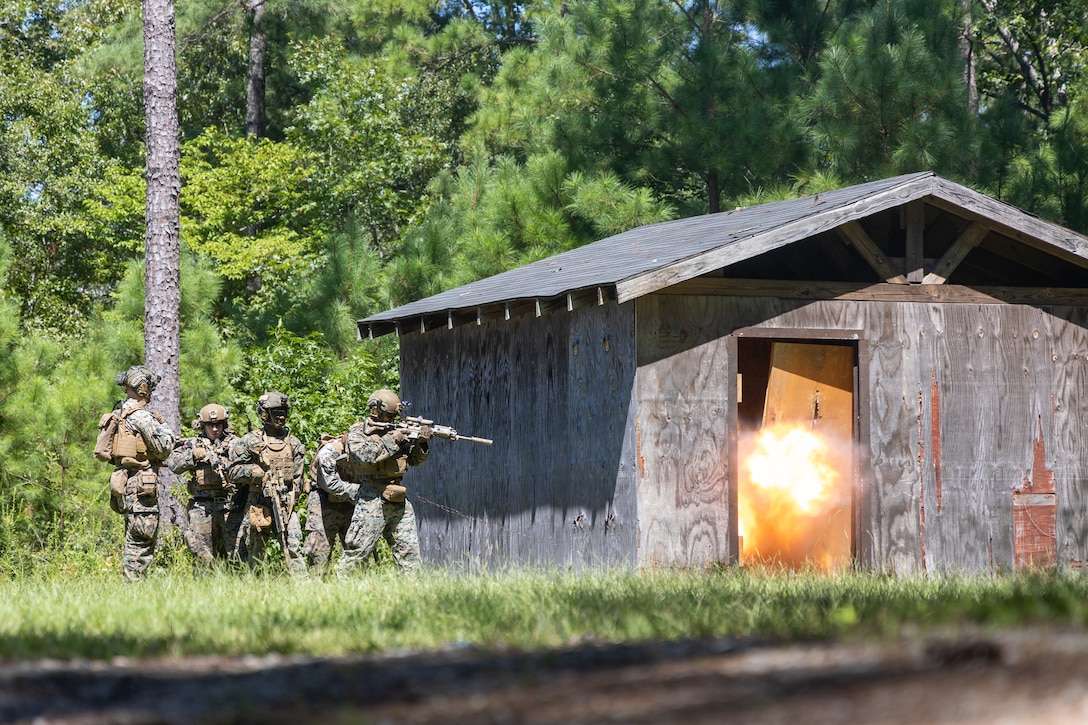 U.S. Marines with Fox Company, 2nd Battalion, 2nd Marine Regiment breach a doorway during a demolition range at Marine Corps Base Camp Lejeune, North Carolina, Aug. 27, 2025. 2nd Bn., 2nd Marines, the ground combat element of Special Purpose Marine Air-Ground Task Force – Alert Contingency MAGTF, conducted a demolition range to improve the battalion’s ability to clear obstacles and familiarize Marines with different types of explosive charges. (U.S. Marine Corps photo by Lance Cpl. Jack Labrador)