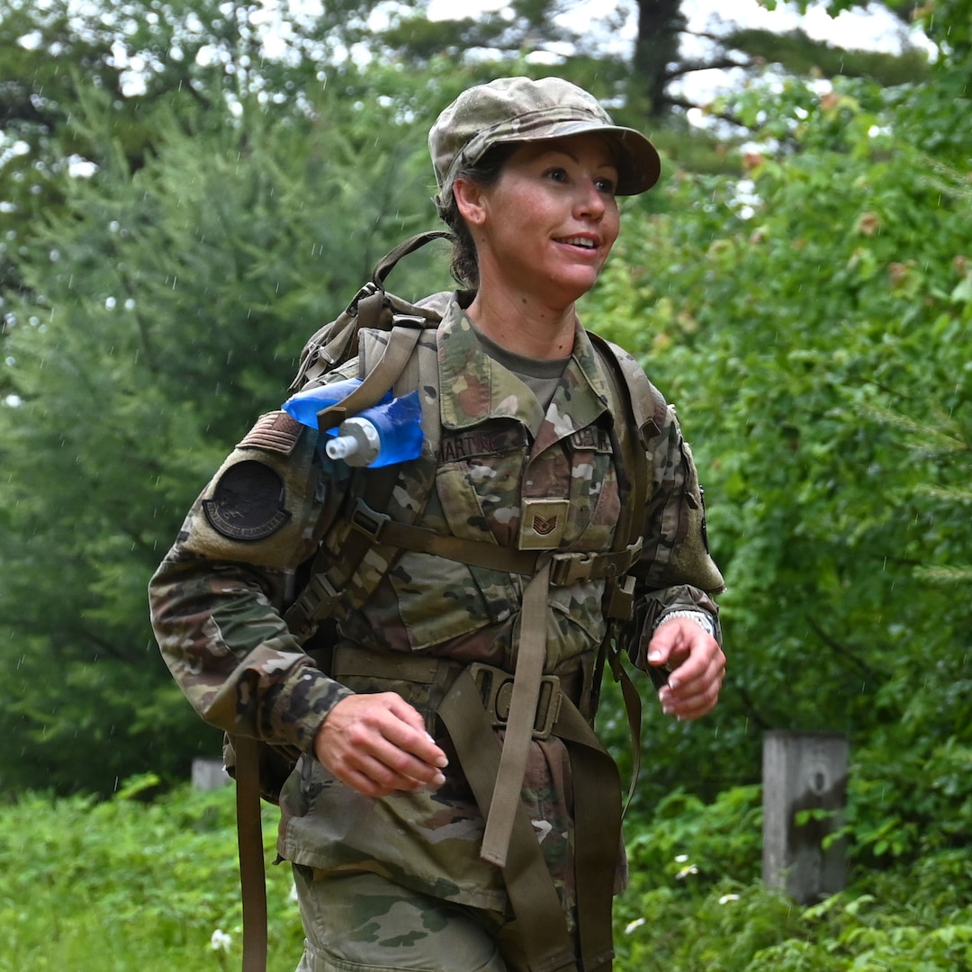 Tech. Sgt. Amber Martine of the 157th Air Refueling Wing, New Hampshire Air National Guard, dashes through Concord’s Karner blue butterfly conservation easement during a 30-kilometer Norwegian Foot March on June 14, 2025.