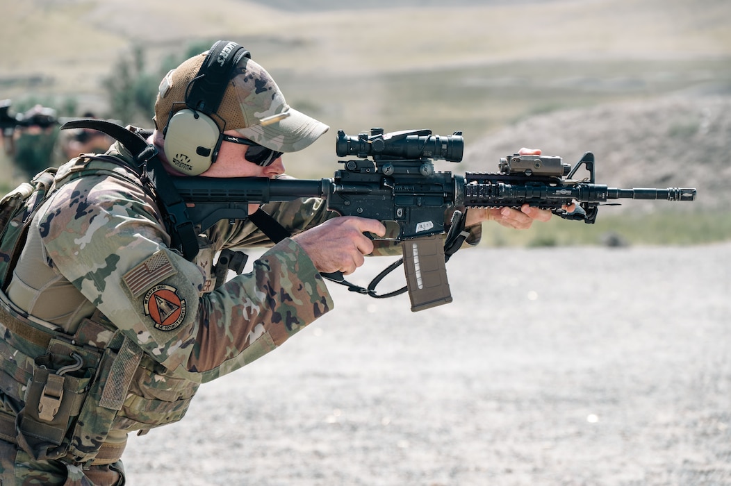 Airman pointing rifle