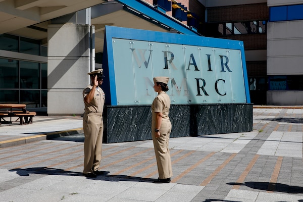 SILVER SPRING, Md. (Sept. 3, 2025) Master Chief Hospital Corpsman Phillip Jean-Gilles, command master chief (CMC) of Naval Medical Research Command (NMRC), recites the oath of enlistment, administered by Lt. Sara Tuck, during a reenlistment ceremony. Immediately following his reenlistment, Jean-Gilles relinquished his position as CMC to Master Chief Hospital Corpsman Christopher Cariss during a change of office ceremony. NMRC, headquarters of Navy Medicine Research & Development, is engaged in a broad spectrum of activity from basic science in the laboratory to field studies in austere and remote areas of the world to investigations in operational environments. In support of Navy, Marine Corps and joint U.S. warfighter health, readiness and lethality, researchers study infectious diseases, biological warfare detection and defense, combat casualty care, environmental health concerns, aerospace and undersea medicine, operational mission support and epidemiology. (U.S. Navy photo by Aleece Williams/Released)