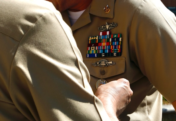 SILVER SPRING, Md. (Sept. 3, 2025) Capt. Eric Welsh, commander, Naval Medical Research Command (NMRC) pins the Command Master Chief (CMC) Identification Badge on Master Chief Hospital Corpsman Christopher Cariss. Cariss received the badge during a change of office ceremony where he relieved Master Chief Hospital Corpsman Phillip Jean-Gilles from NMRC’s CMC responsibilities. NMRC, headquarters of Navy Medicine Research & Development, is engaged in a broad spectrum of activity from basic science in the laboratory to field studies in austere and remote areas of the world to investigations in operational environments. In support of Navy, Marine Corps and joint U.S. warfighter health, readiness and lethality, researchers study infectious diseases, biological warfare detection and defense, combat casualty care, environmental health concerns, aerospace and undersea medicine, operational mission support and epidemiology. (U.S. Navy photo by Aleece Williams/Released)