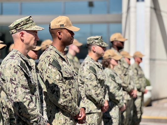 SILVER SPRING, Md. (Sept. 3, 2025) Sailors with Naval Medical Research Command (NMRC), stand in formation during a reenlistment and change of office ceremony, in which Master Chief Hospital Corpsman Phillip Jean-Gilles, upon reenlisting in the U.S. Navy, relinquished his position as command master chief to Master Chief Hospital Corpsman Christopher Cariss. NMRC, headquarters of Navy Medicine Research & Development, is engaged in a broad spectrum of activity from basic science in the laboratory to field studies in austere and remote areas of the world to investigations in operational environments. In support of Navy, Marine Corps and joint U.S. warfighter health, readiness and lethality, researchers study infectious diseases, biological warfare detection and defense, combat casualty care, environmental health concerns, aerospace and undersea medicine, operational mission support and epidemiology. (U.S. Navy photo by Tommy Lamkin/Released)