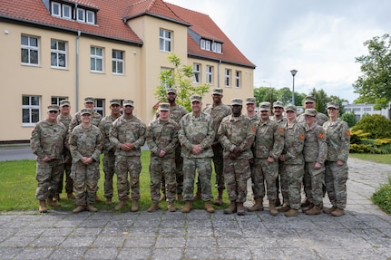 U.S. Air Force Maj. Gen. Gary Keefe, the Adjutant General of the Massachusetts National Guard (MANG), and senior leaders from the 164th Transportation Battalion visit the 1060th Transportation Company (TC) and their team during their deployment in Zagan, Poland, May 23, 2025.