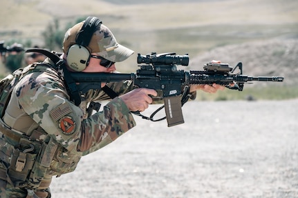 Airman pointing rifle
