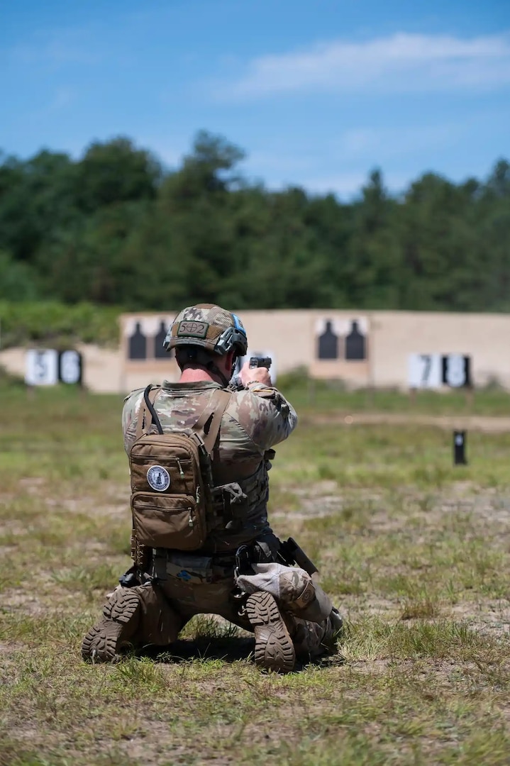 Capt. Patrick Randall, recruiting and retention officer for the New Hampshire Army National Guard, shoots at a 35-yard target during the “All Army Pistol Team Match,” the final event of the 2025 New Hampshire National Guard Combat Marksmanship Competition at Fort Devens on July 16, 2025.