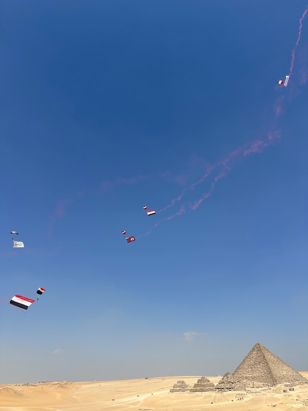Egyptian service members practice Military Free Fall (MFF) over The Great Pyramids of Giza before the kick off of BRIGHT STAR 2025 in Giza, Egypt on Aug. 27, 2025. BRIGHT STAR represents a vital opportunity to strengthen cooperation with Egypt and participating countries and enhance our collective ability to address shared threats to regional security across all levels of command. (Courtesy Photo)
