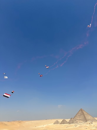 Egyptian service members practice Military Free Fall (MFF) over The Great Pyramids of Giza before the kick off of BRIGHT STAR 2025 in Giza, Egypt on Aug. 27, 2025. BRIGHT STAR represents a vital opportunity to strengthen cooperation with Egypt and participating countries and enhance our collective ability to address shared threats to regional security across all levels of command. (Courtesy Photo)