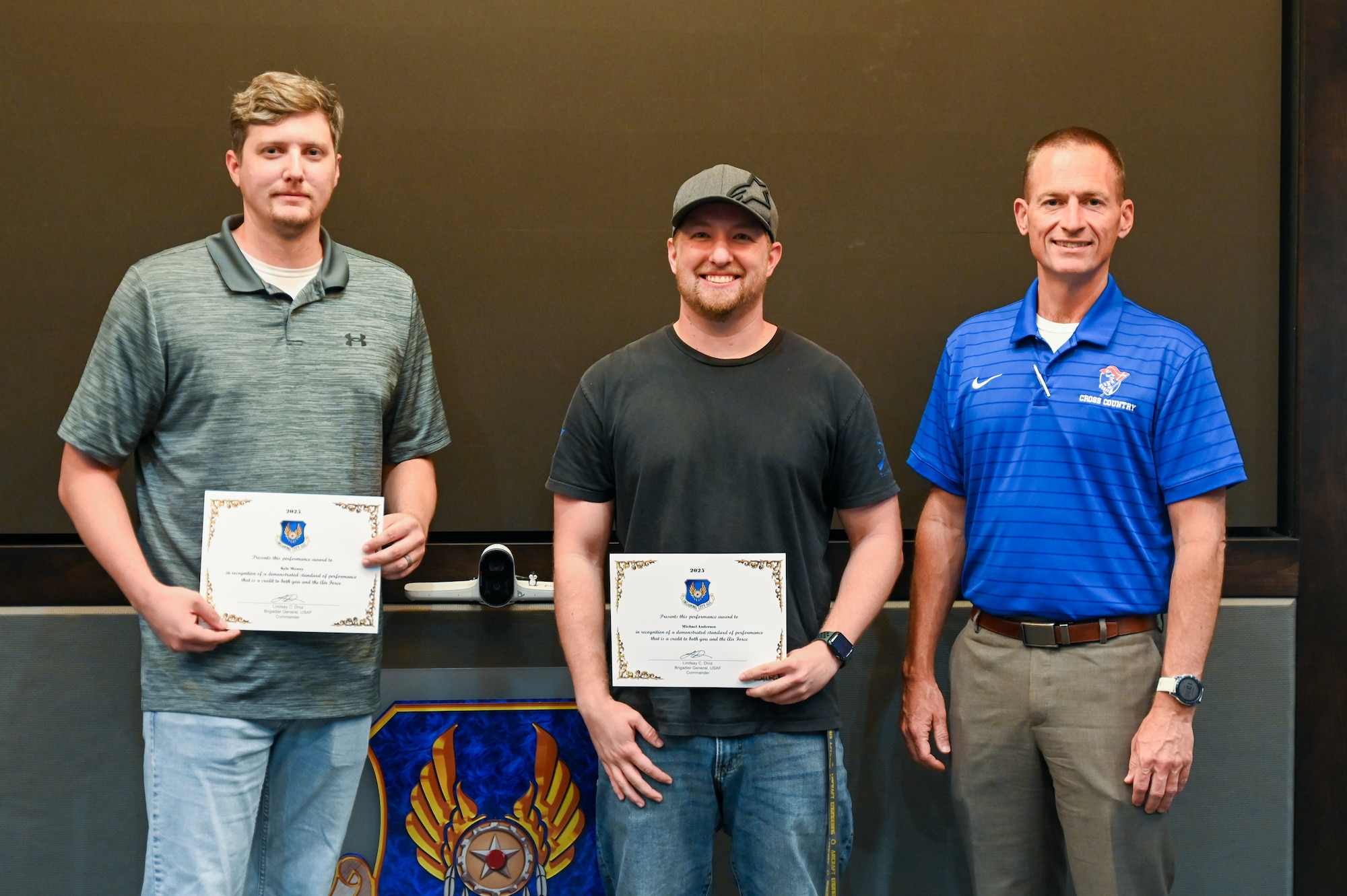 Group stands for a photo with certificates