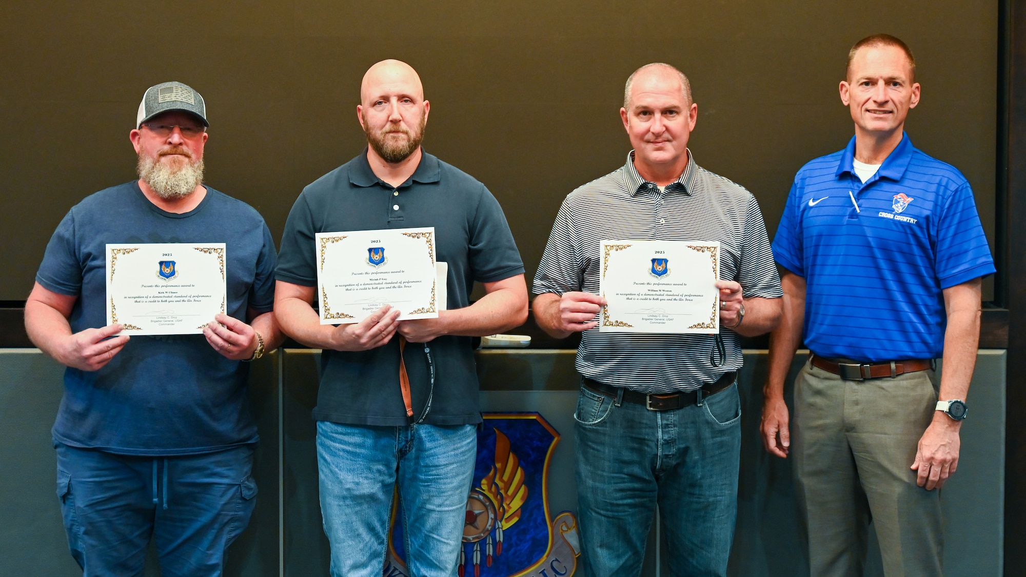 Group stands for a photo with certificates