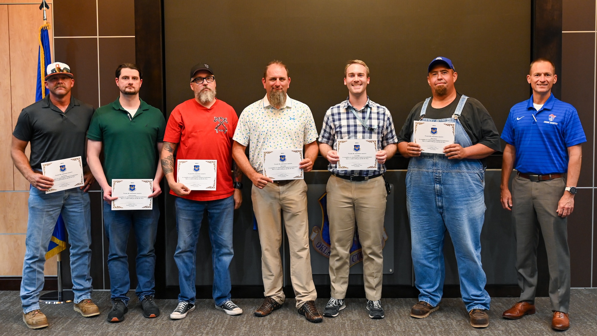 Group stands for a photo with certificates