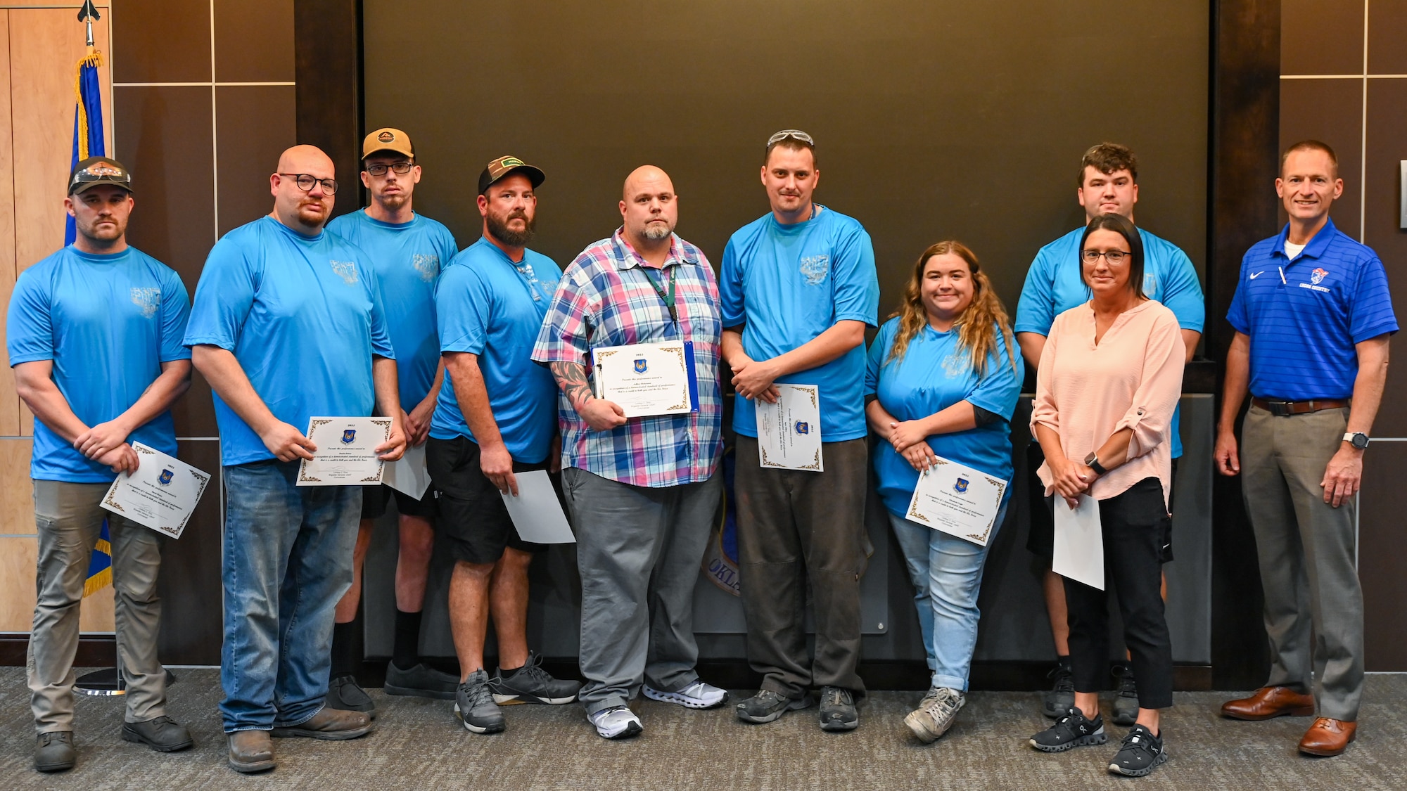 Group stands for photo holding certificates.