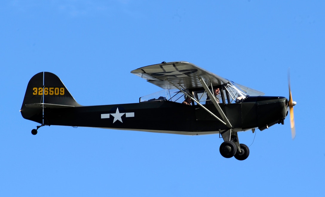 A Cessna L-19 flies as part of the warbirds demonstration at the Arctic Thunder Open House