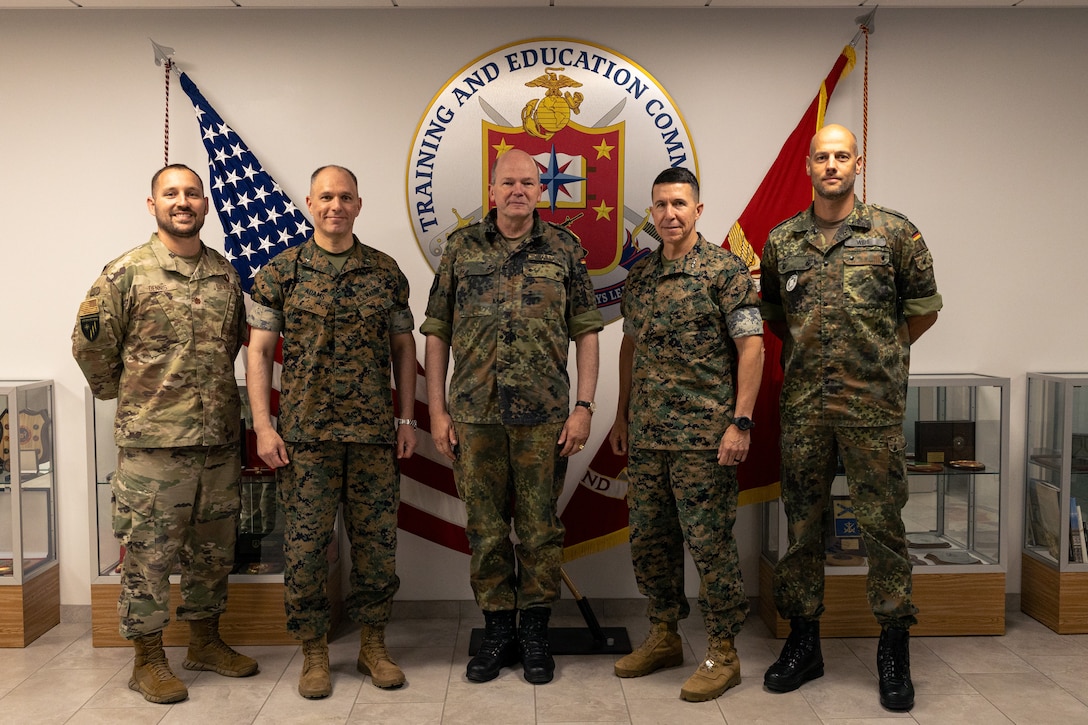 U.S. Marine Corps, U.S. Air Force, and NATO Allied leaders pose for a group photo during a visit to Training and Education Command on Marine Corps Base Quantico, Virginia, Sept. 2, 2025. The visit focused on collaboration between TECOM and NATO’s Joint Warfare Centre in modeling and simulation and staff training. (U.S. Marine Corps photo by Cpl. Joshua Barker)