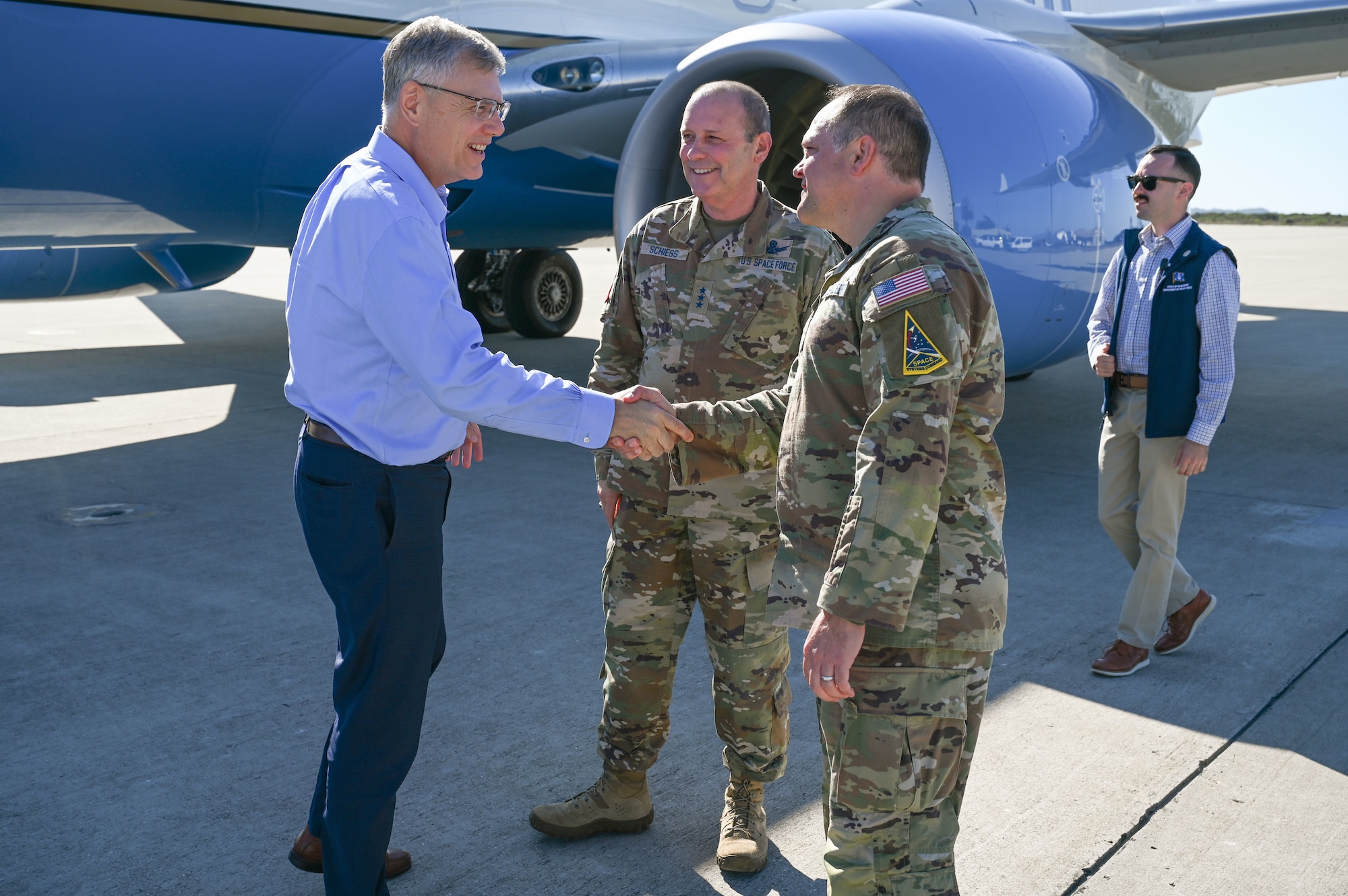 Secretary of the Air Force Troy Meink, left, greets Col. James T. Horne III, Space Launch Delta 30 commander, right, alongside Lt. Gen. Douglas Schiess, right, Commander, U.S. Space Forces - Space; and United States Space Command’s Combined Joint Force Space Component Commander, during his visit to Vandenberg Space Force Base, Calif. Aug. 27, 2025. During his visit, Meink had the opportunity to tour several facilities on base to become familiar with daily operations at Vandenberg. (U.S. Space Force photo by Senior Airman Kevin Hernandez)