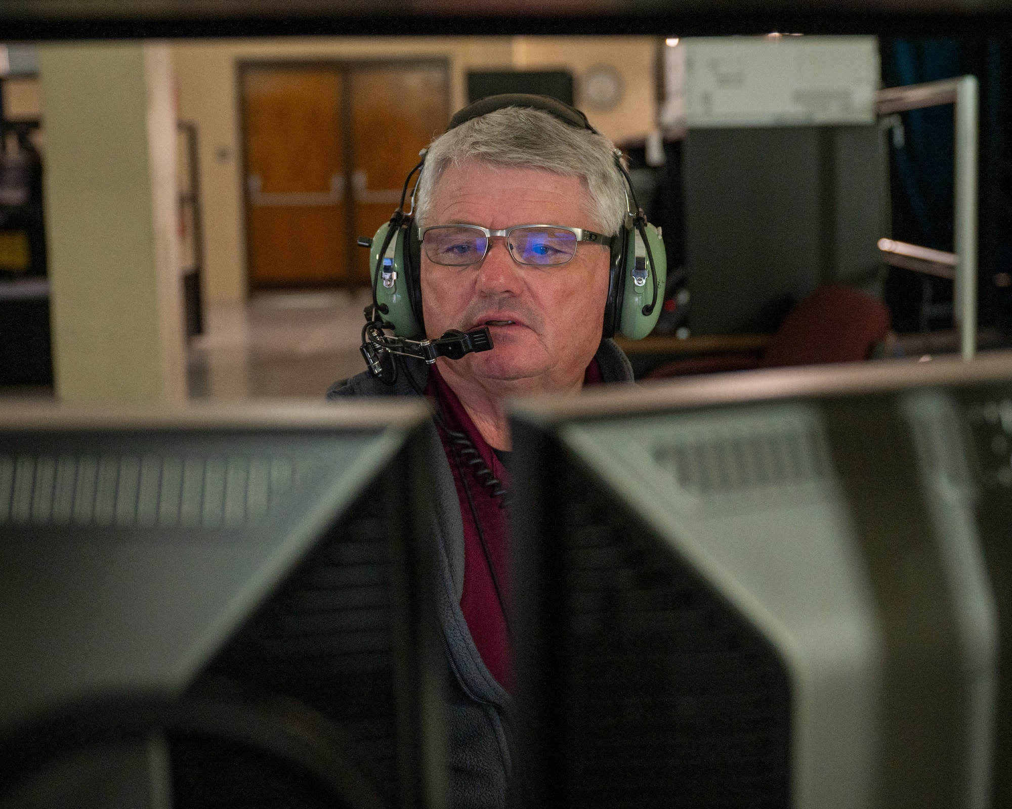 Frederick Berg, 47th Student Squadron civilian simulator instructor, sets up a T-38C Talon simulator at Laughlin Air Force Base, Texas, Sept. 3, 2025. Berg has spent 40 years in federal service teaching thousands of classes since 1996 and has more than 15,000 hours in simulator flights. (U.S. Air Force photo by Staff Sgt. Nicholas Larsen)