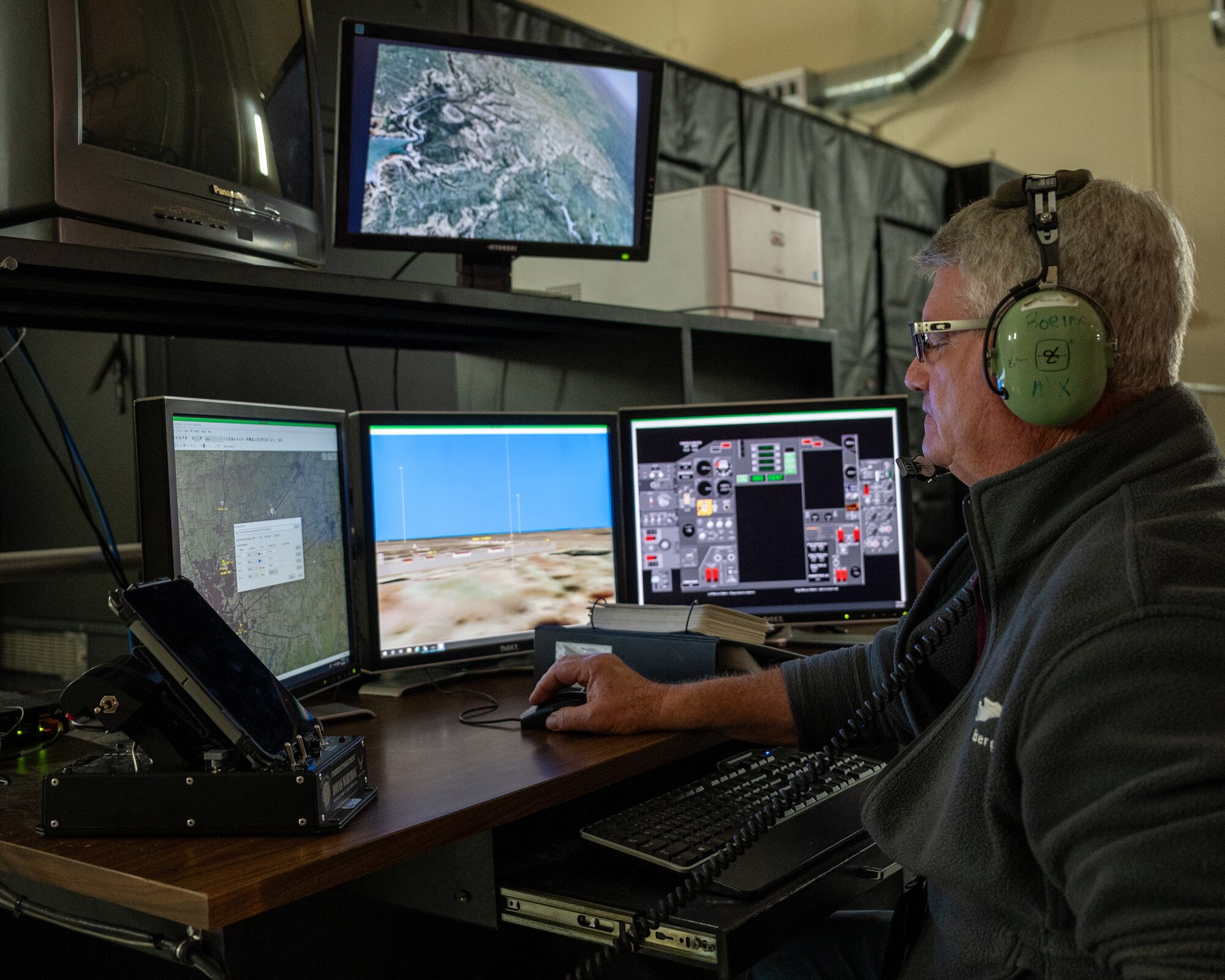 Frederick Berg, 47th Student Squadron civilian simulator instructor, sets up a T-38C Talon simulator at Laughlin Air Force Base, Texas, Sept. 3, 2025. Berg has spent 40 years in federal service teaching thousands of classes since 1996 and has more than 15,000 hours in simulator flights. (U.S. Air Force photo by Staff Sgt. Nicholas Larsen)