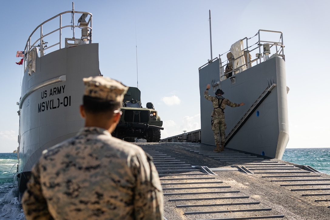 A U.S. Army Maneuver Support Vessel (Light) (MSV(L)) supported by 7th Transportation Brigade is utilized for on and offloading drills with U.S. Marines with 3d Littoral Logistics Battalion (LLB), 3d Marine Littoral Regiment, 3d Marine Division, on Marine Corps Base Hawaii, Aug. 26, 2025.