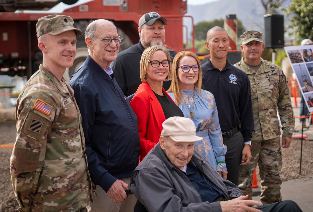 Representatives with the U.S. Army Corps of Engineers, FEMA, California Governor’s Office of Emergency Services, Los Angeles County and the City of Los Angeles gather Aug. 26 with the property owner Noland West in the Los Angeles neighborhood of Pacific Palisades to mark the start of debris removal at the last property enrolled in the USACE debris-removal program.