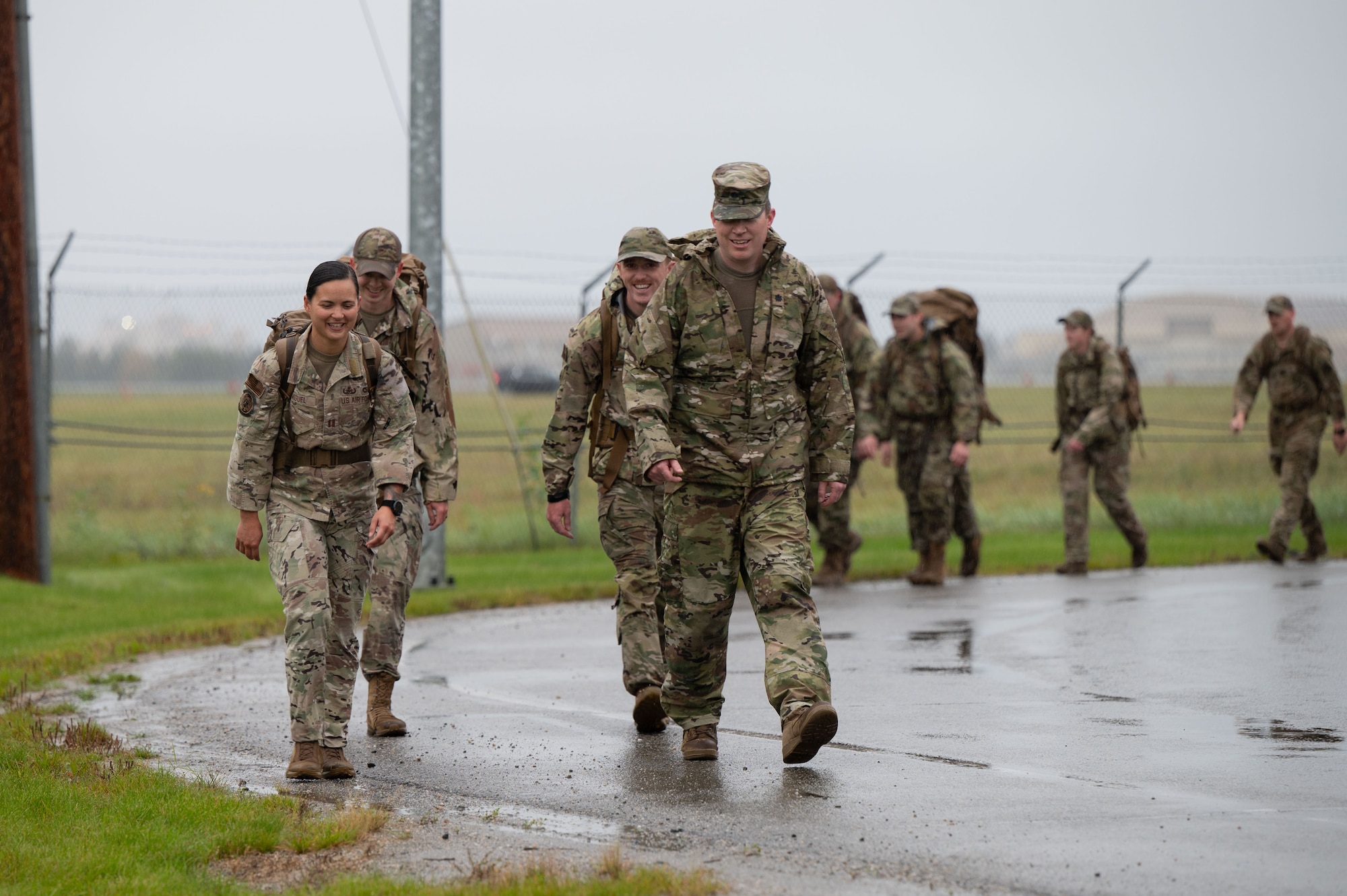 U.S. Air Force Capt. Alexis Miguel, 354th Civil Engineer Squadron explosive ordnance disposal flight chief, front left, Lt. Col. Brendan Dorsey-Spitz, 354th CES Commander, front right, Airman 1st Class Nickolas Stirling and Staff Sgt. Andrew Payne, 354th CES explosive ordnance disposal team members, back, march in the 11th Annual Explosive Ordinance Disposal Memorial Ruck at Eielson Air Force Base, Alaska, Sept. 5, 2025.