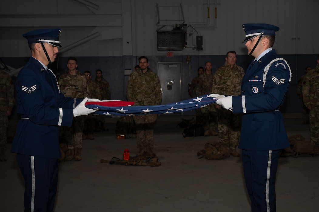 The Eielson Base Honor Guard folds an American flag before the 11th Annual Explosive Ordinance Disposal Memorial Ruck on Eielson Air Force Base, Alaska, Sept. 5, 2025.
