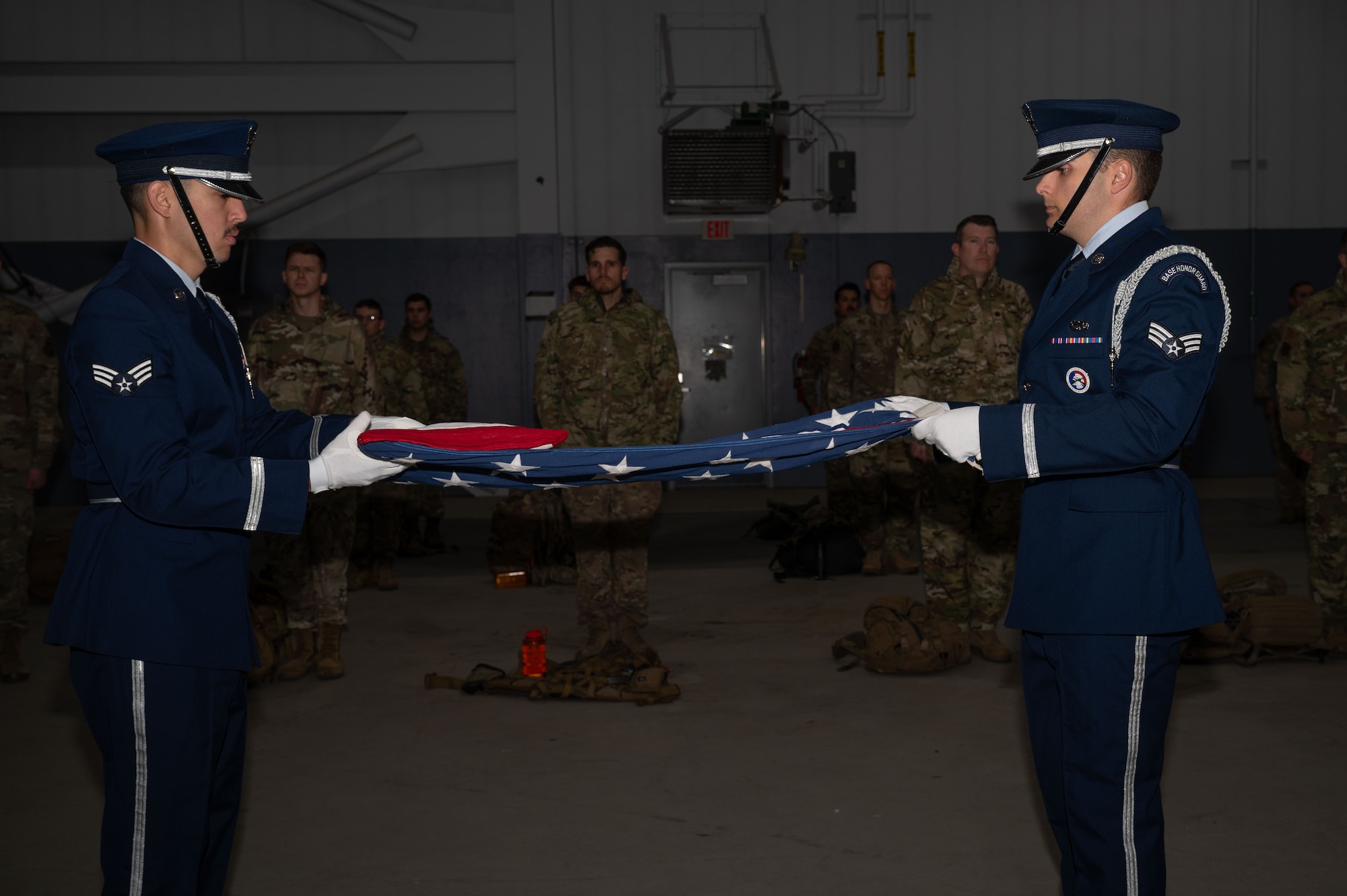 The Eielson Base Honor Guard folds an American flag before the 11th Annual Explosive Ordinance Disposal Memorial Ruck on Eielson Air Force Base, Alaska, Sept. 5, 2025.