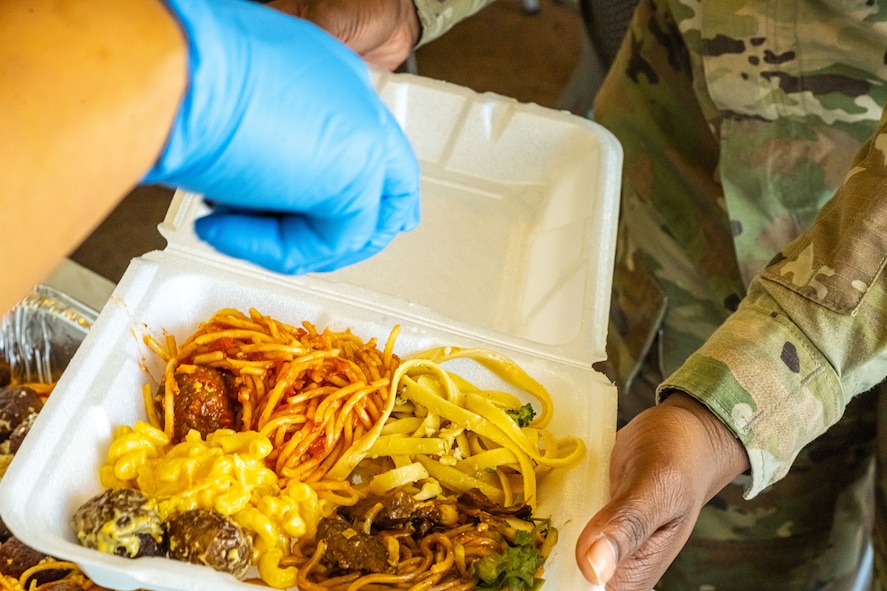 An Airman receives food during the monthly dorm dinner at Minot Air Force Base, North Dakota, Sep. 5, 2025. Dorm dinners provide free meals and a social environment for Airmen in the dorms.