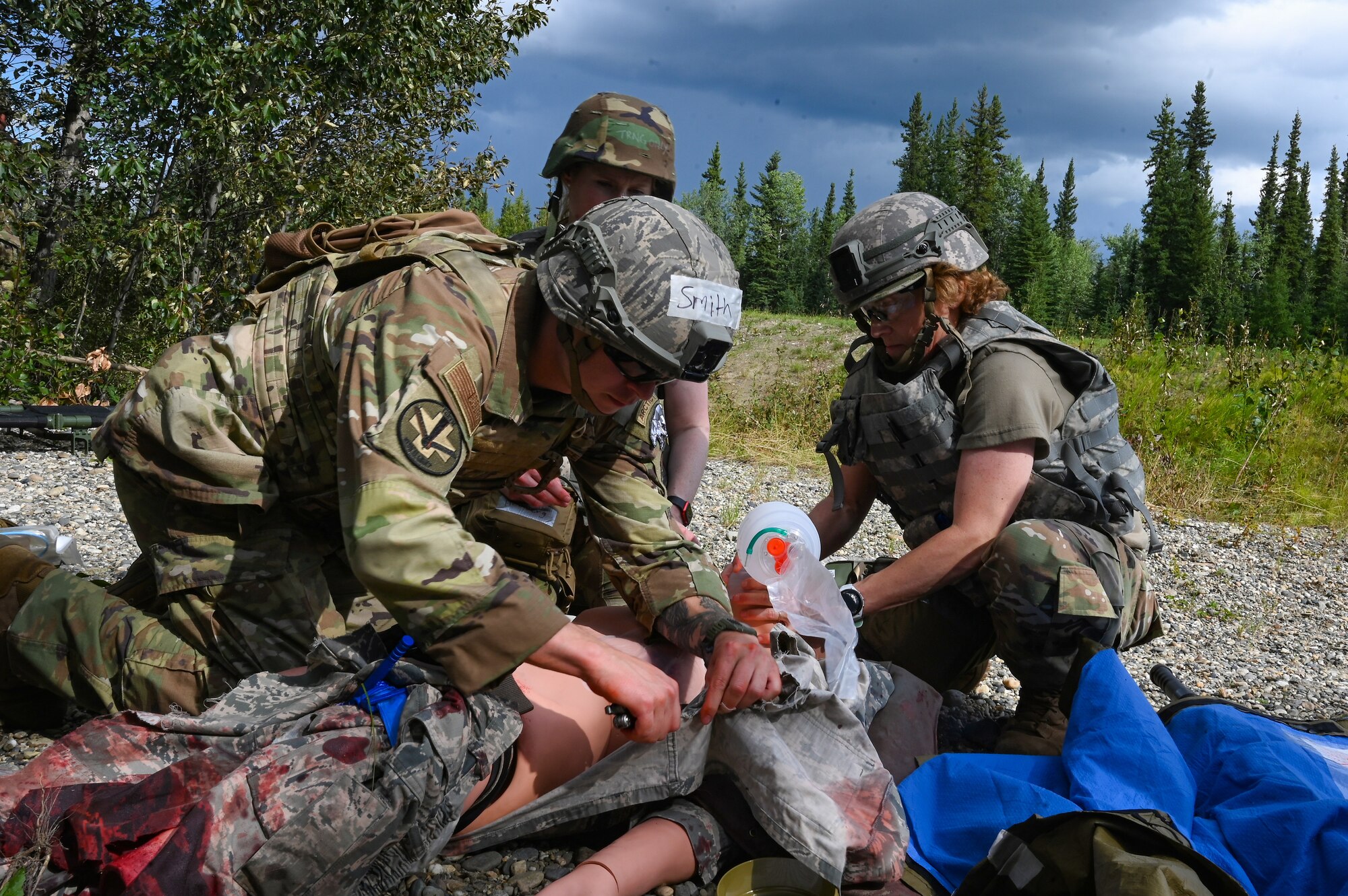 actical Combat Casualty Care (TCCC) training participants from the 168th Medical Group respond and provide treatment to a simulated casualty patient.