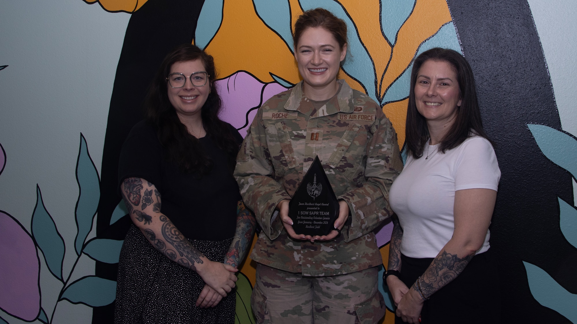 The Hurlburt Field Sexual Assault Prevention and Response team poses with the 2024 Team Angel Award at Hurlburt Field, Florida, Aug. 26, 2025.