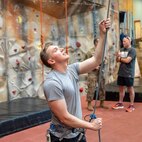 U.S. Air Force Tech. Sgt. Ty LaCourse, 48th Intelligence Support Squadron cyber systems operation chief, demonstrating the safe use of rock-climbing equipment while working as an instructor at the Ramstein Air Force Base Outdoor Recreation Center, Germany.