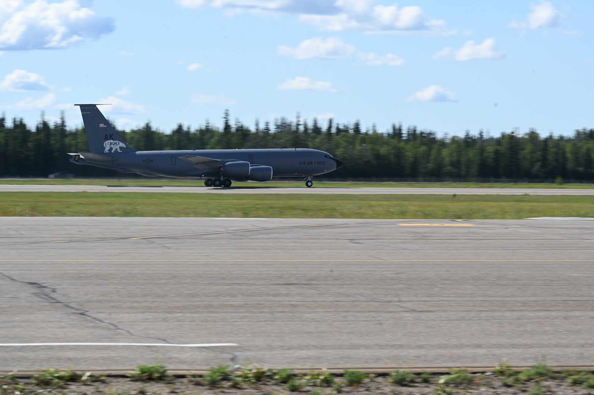 An Alaska Air National Guard 168th Wing KC-135 Stratotanker featuring the  "Minto" tail flash takes off prior to the naming ceremony on July 31, 2025, at Eielson Air Force Base.
