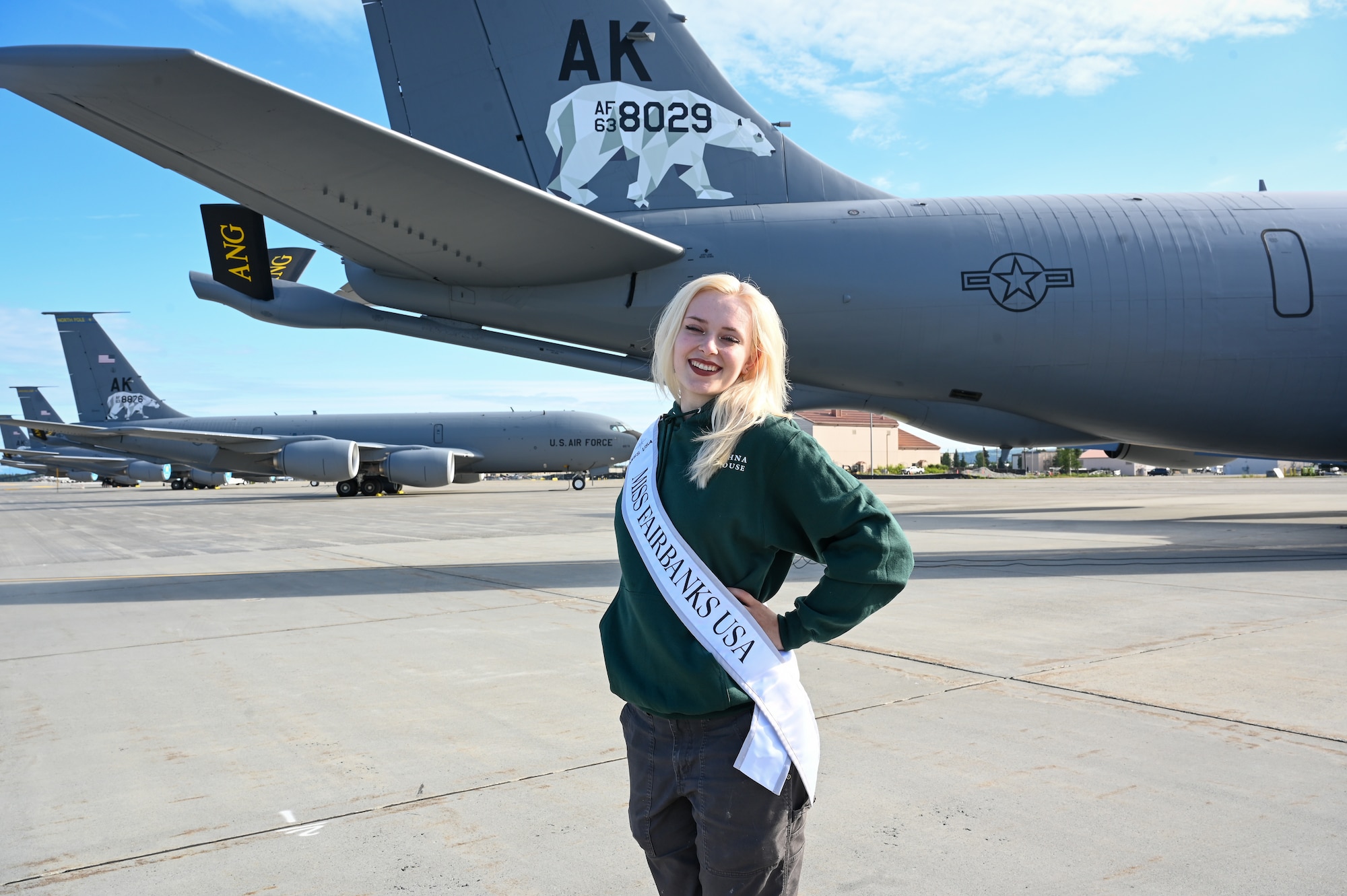 Melaynee White, Miss Fairbanks, poses in front of a KC-135 Stratotanker at the Alaska Air National Guard’s 168th Wing, where she serves as a civilian maintenance worker with the Civil Engineering Squadron.