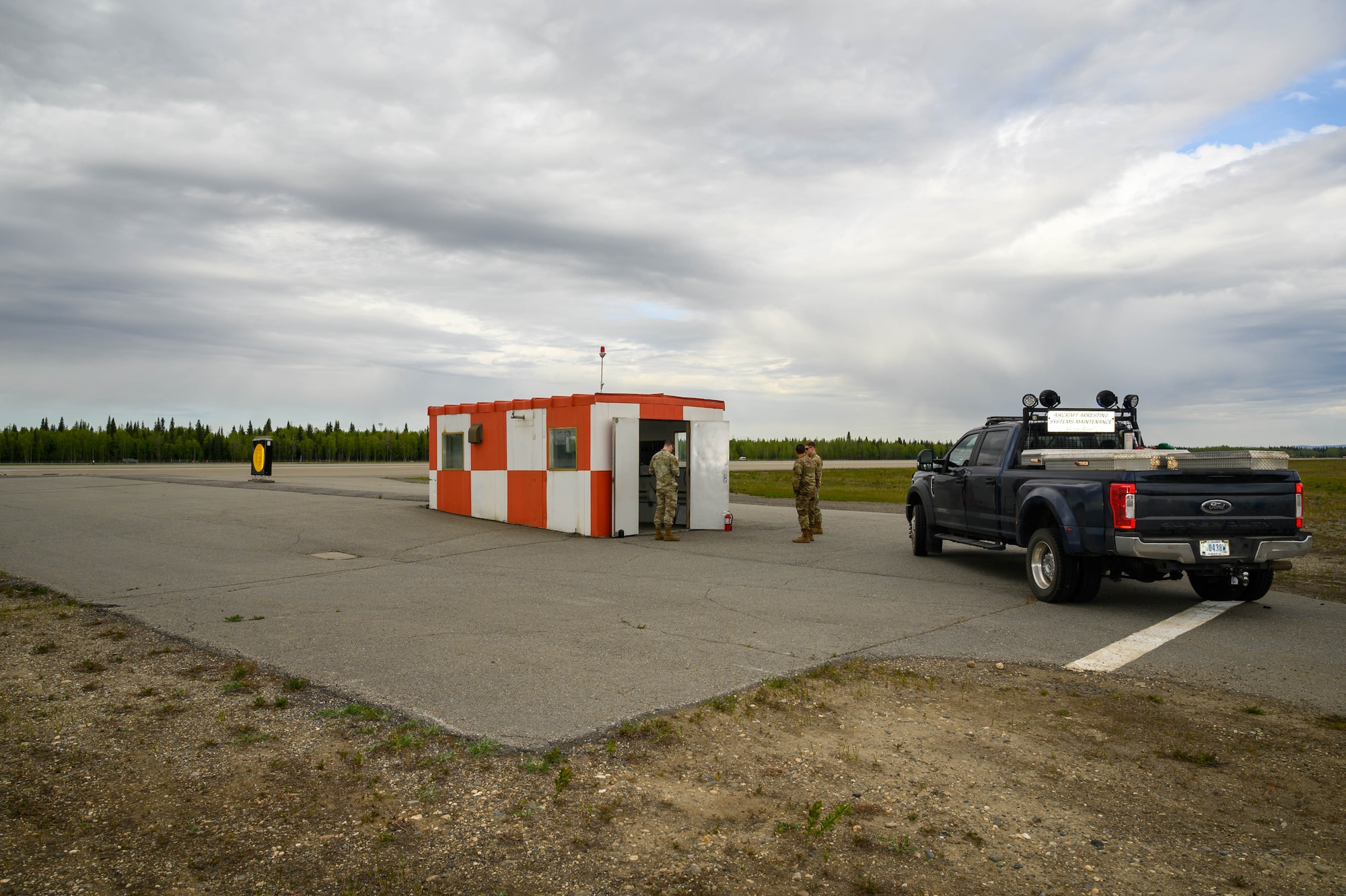 U.S. Air Force Airmen from the 354th Civil Engineering Squadron perform maintenance on an Aircraft Arresting System prior to an annual test at Eielson Air Force Base, Alaska, May 29, 2025.