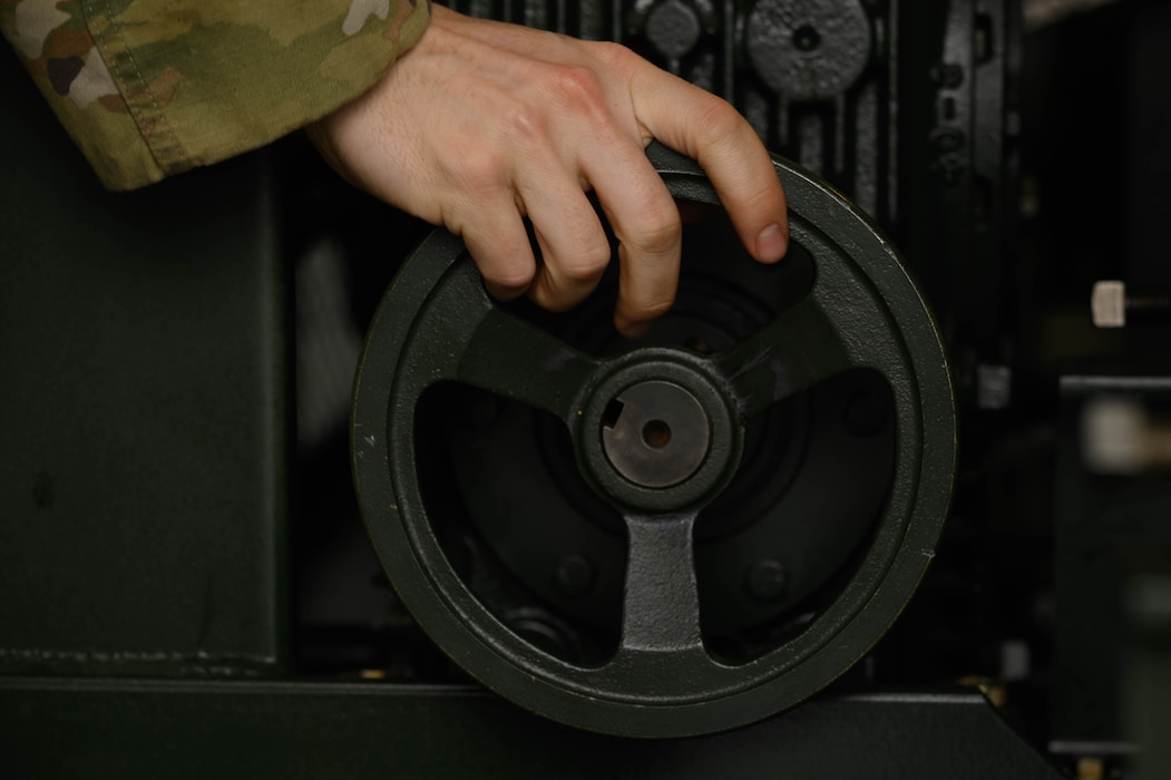 U.S. Air Force Staff Sgt. Troy Smith, 354th Civil Engineering Squadron power production journeyman, adjusts a wheel on an Aircraft Arresting System during a systems test at Eielson Air Force Base, Alaska, May 29, 2025.