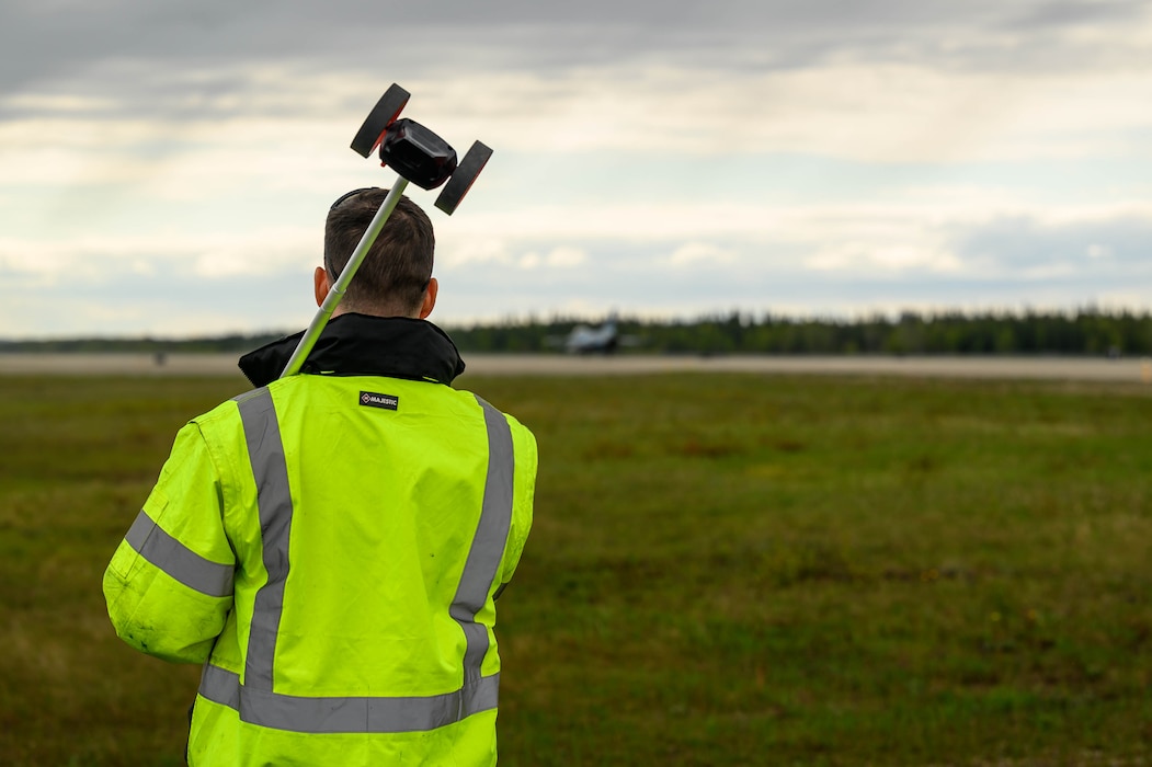 U.S. Air Force Tech. Sgt. Matthew Frazier, 354th Civil Engineering Squadron power production section chief, monitors an F-16 Fighting Falcon after testing the Aircraft Arresting System at Eielson Air Force Base, Alaska, May 29, 2025.