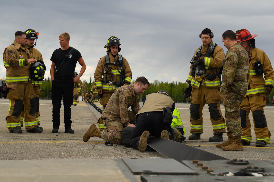 U.S. Air Force Airmen from the 354th Civil Engineering Squadron reset an Aircraft Arresting System cable after an annual maintenance test at Eielson Air Force Base, Alaska, May 29, 2025.