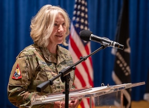 a senior enlisted leader speaks at a podium