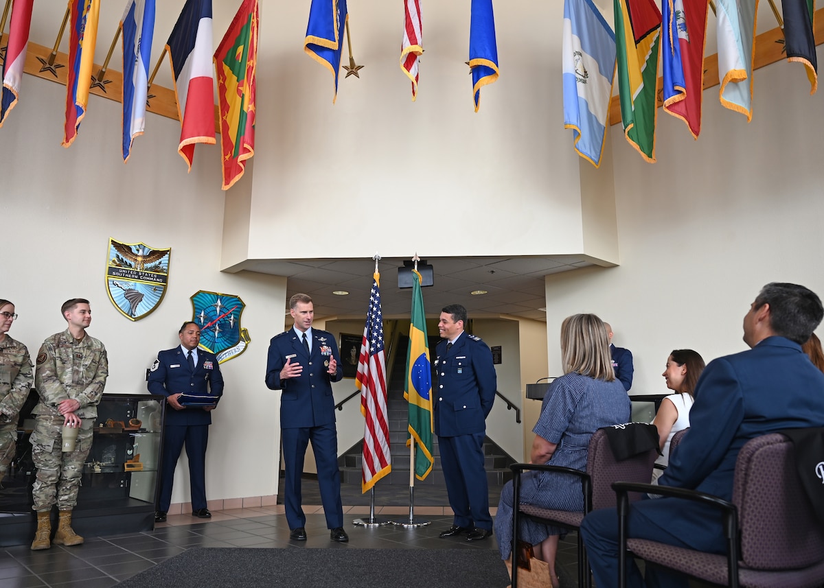 U.S. Air Force Maj. Gen. David Mineau, Air Forces Southern commander, left, thanks Brazilian Air Force Col. Leonardo Macedo, foreign liaison officer, right, for his dedication and time at Davis-Monthan Air Force Base, Arizona, Sept. 4, 2025. Macedo laid the groundwork to strengthen operational capabilities and enhance interoperability between the U.S. and Brazilian Air Forces. (U.S. Air Force photo by Staff Sgt. Abbey Rieves)