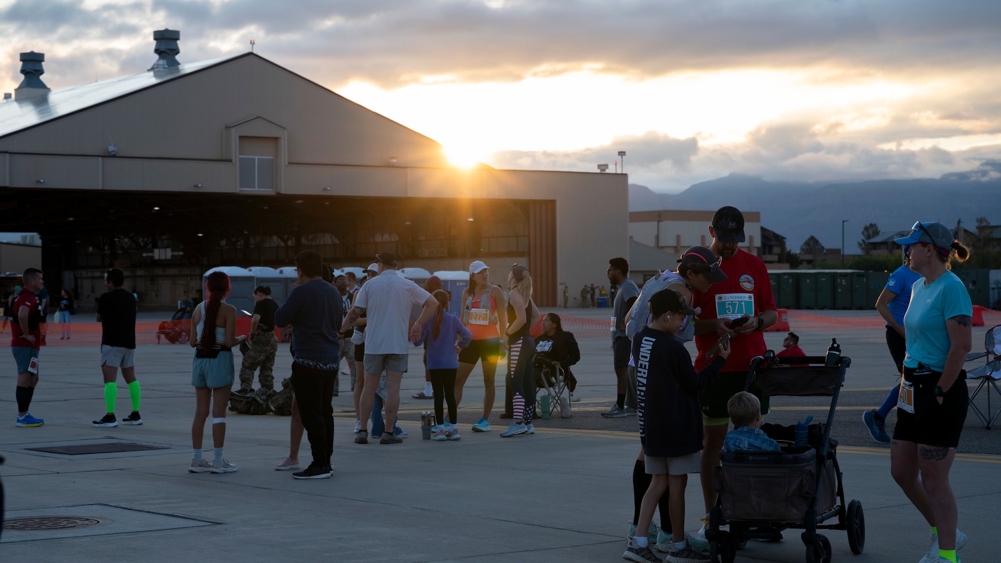 Racers, alongside their family and friends, prepare for the start of the 3rd annual Ace of Races Marathon at Holloman Air Force Base, New Mexico, Sept. 6, 2025. Nearly 500 people from across the country signed up for the race, which consisted of a full and half marathon, a 5K and a 1-mile kids' dash. (U.S. Air Force photo by Tech. Sgt. Victor J. Caputo)