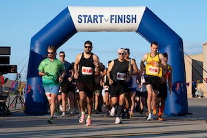 Racers take off at the start of the 3rd annual Ace of Race Marathon at Holloman Air Force Base, New Mexico, Sept. 6, 2025. Nearly 500 people from across the country signed up for the race, which consisted of a full and half marathon, a 5K and a 1-mile kids' dash. (U.S. Air Force photo by Tech. Sgt. Victor J. Caputo)