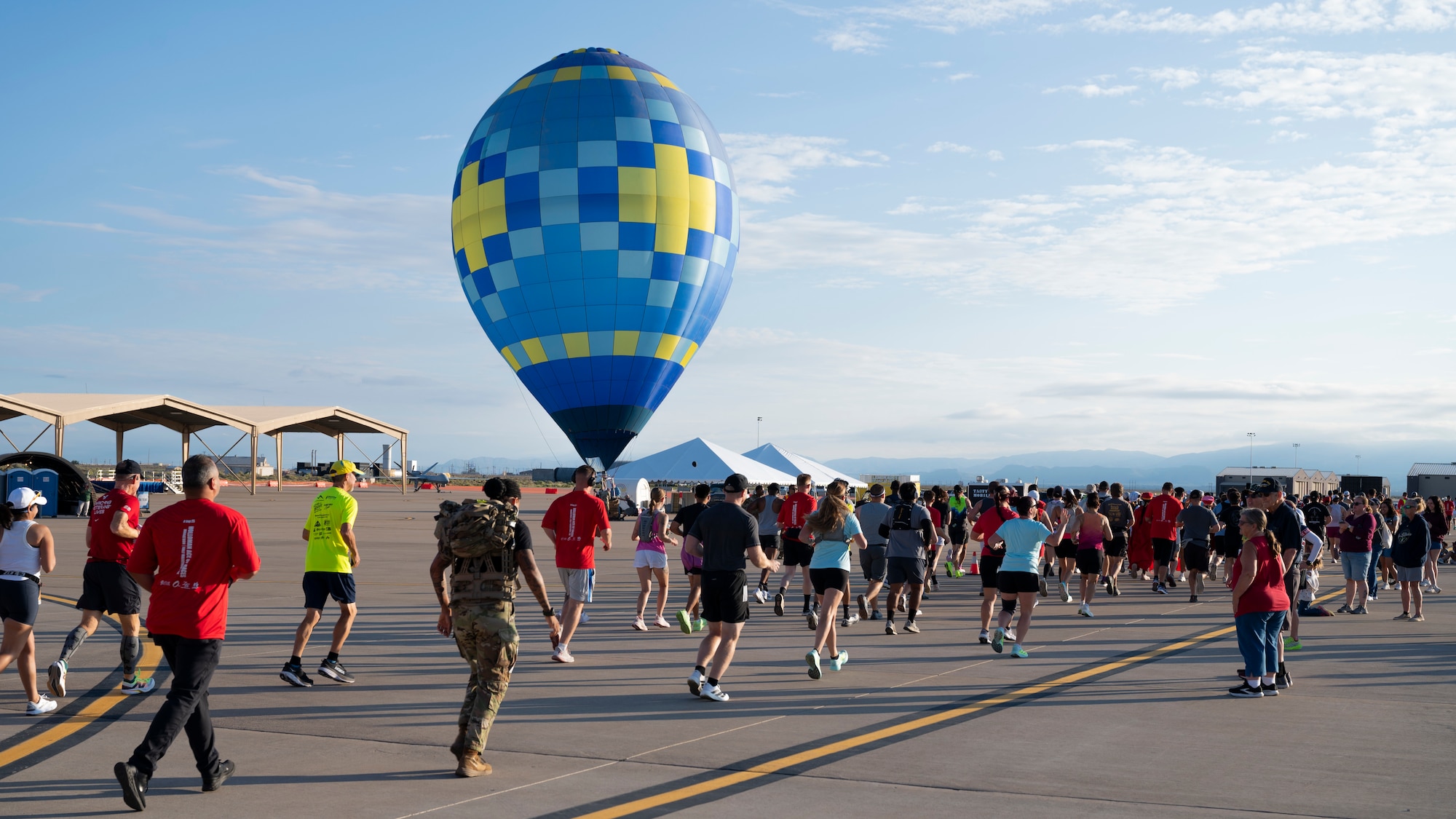 Racers run through the flightline during the 3rd annual Ace of Races Marathon at Holloman Air Force Base, New Mexico, Sept. 6, 2025. In addition to the marathon, Team Holloman also hosted Community Connections Day, a biennial open house to bring together the local and regional community to see first-hand how the base plays a crucial role in national defense. (U.S. Air Force photo by Tech. Sgt. Victor J. Caputo)